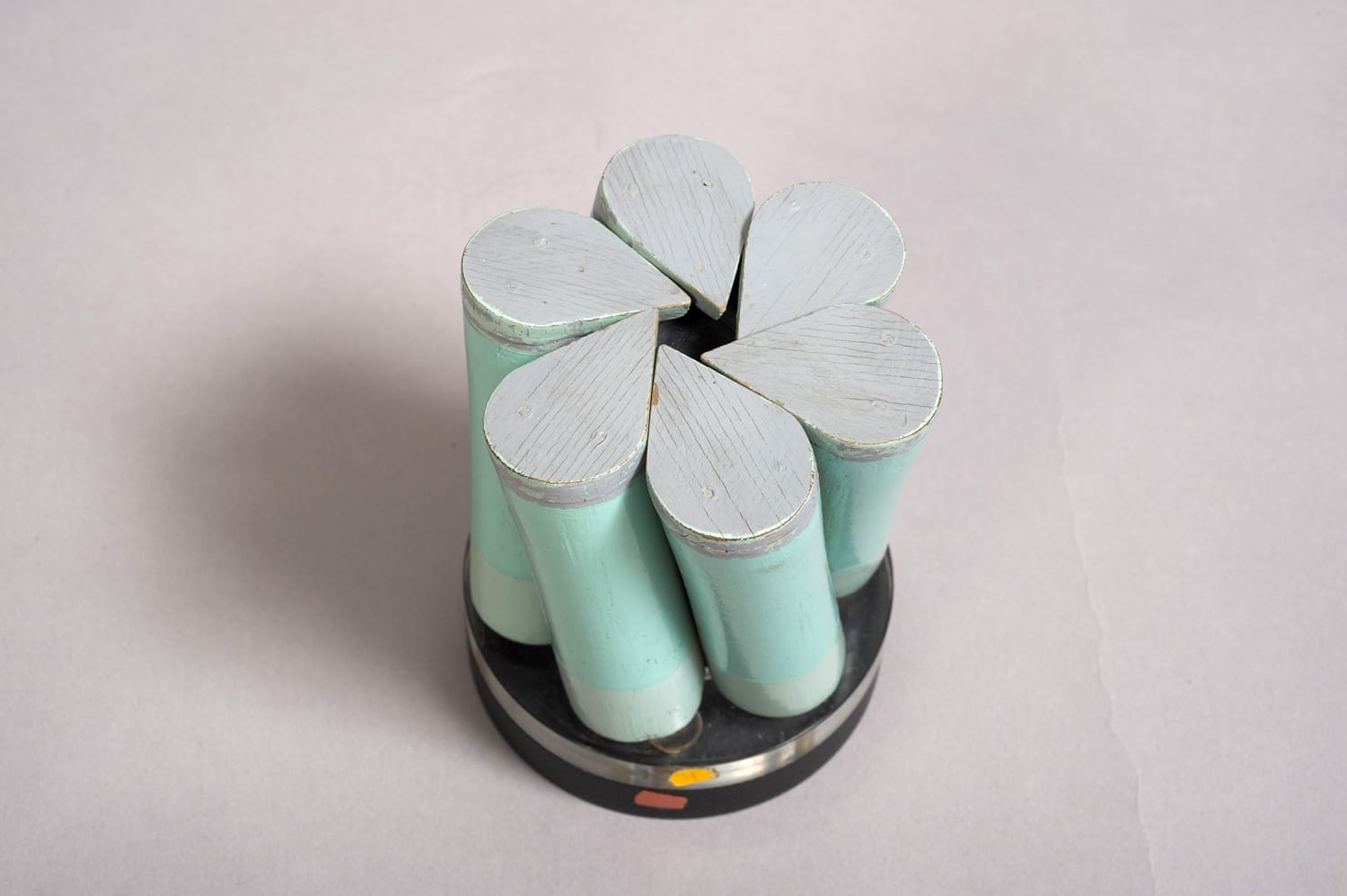 Light green cylindrical model which is split into segmented parts