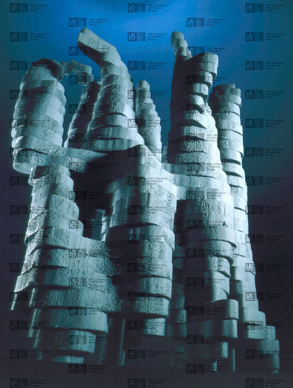 Grey-blue 3D model shows multiple textured, layered columns resembling abstract towers on a dark blue background with with LMB logo watermark overlay.