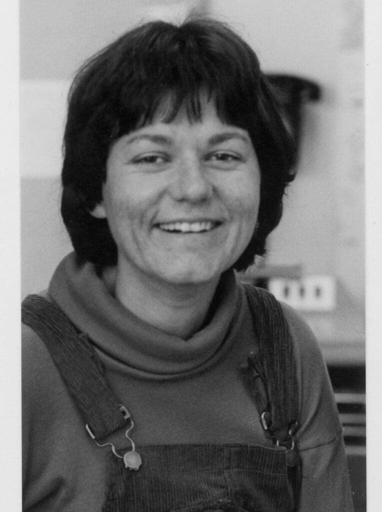 Black and white photograph of a woman facing the camera