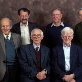 Group of scientists posing for a formal portrait with LMB logo watermark overlay.