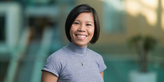 Kelly Nguyen on blurred background