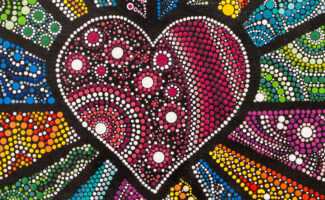 A heart made of pink and white dots centered on a black canvas, surrounded by colorful dot-filled segments radiating outwards.