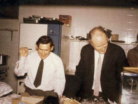 Sydney Brenner and Francis Crick stood in a kitchen