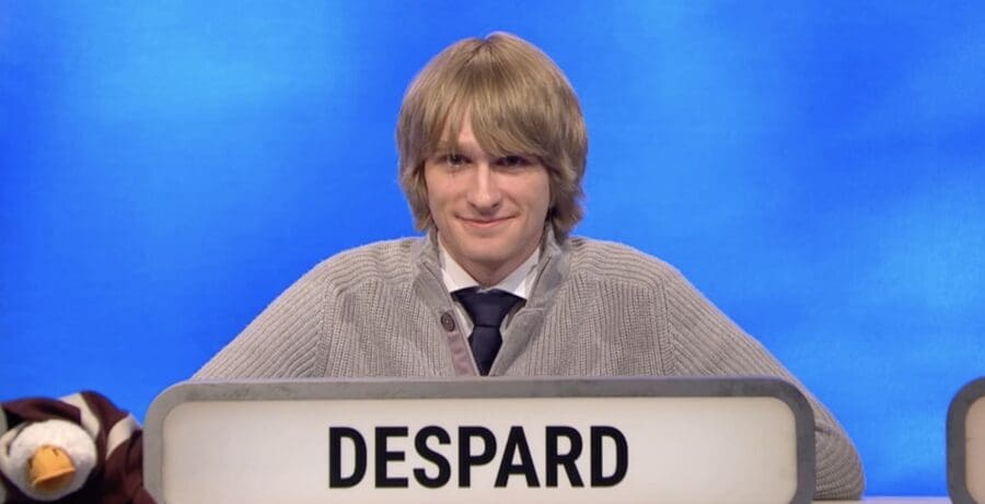 Oscar sat behind a sign reading his surname 'DESPARD'