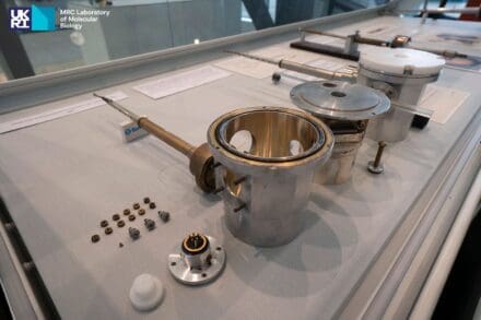 Silver-coloured metal scientific instruments displayed in an exhibition case
