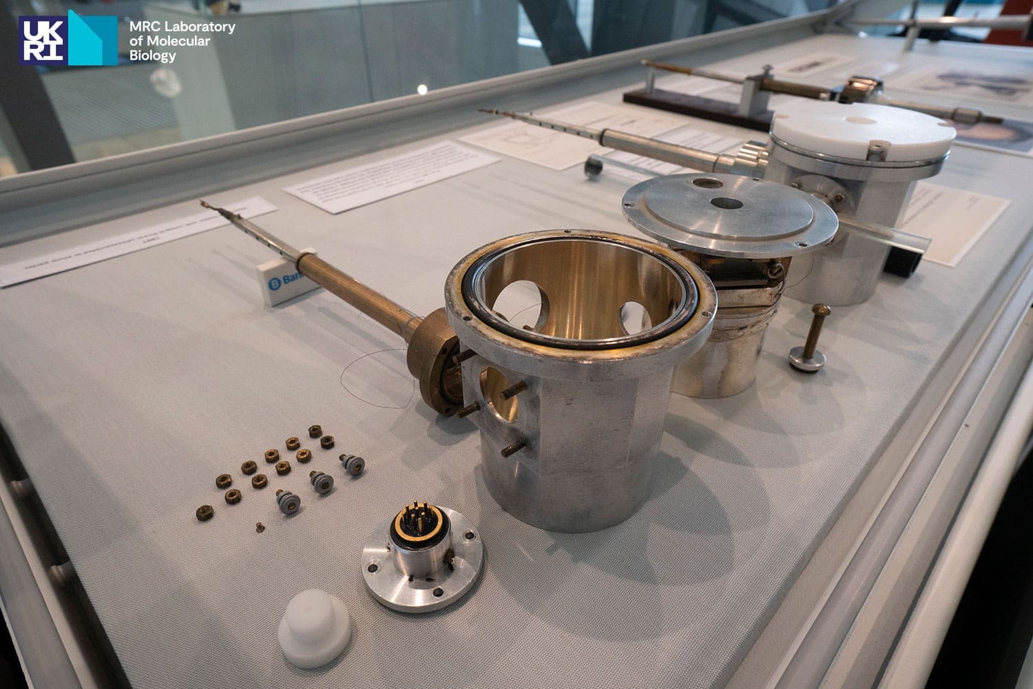 Silver-coloured metal scientific instruments displayed in an exhibition case