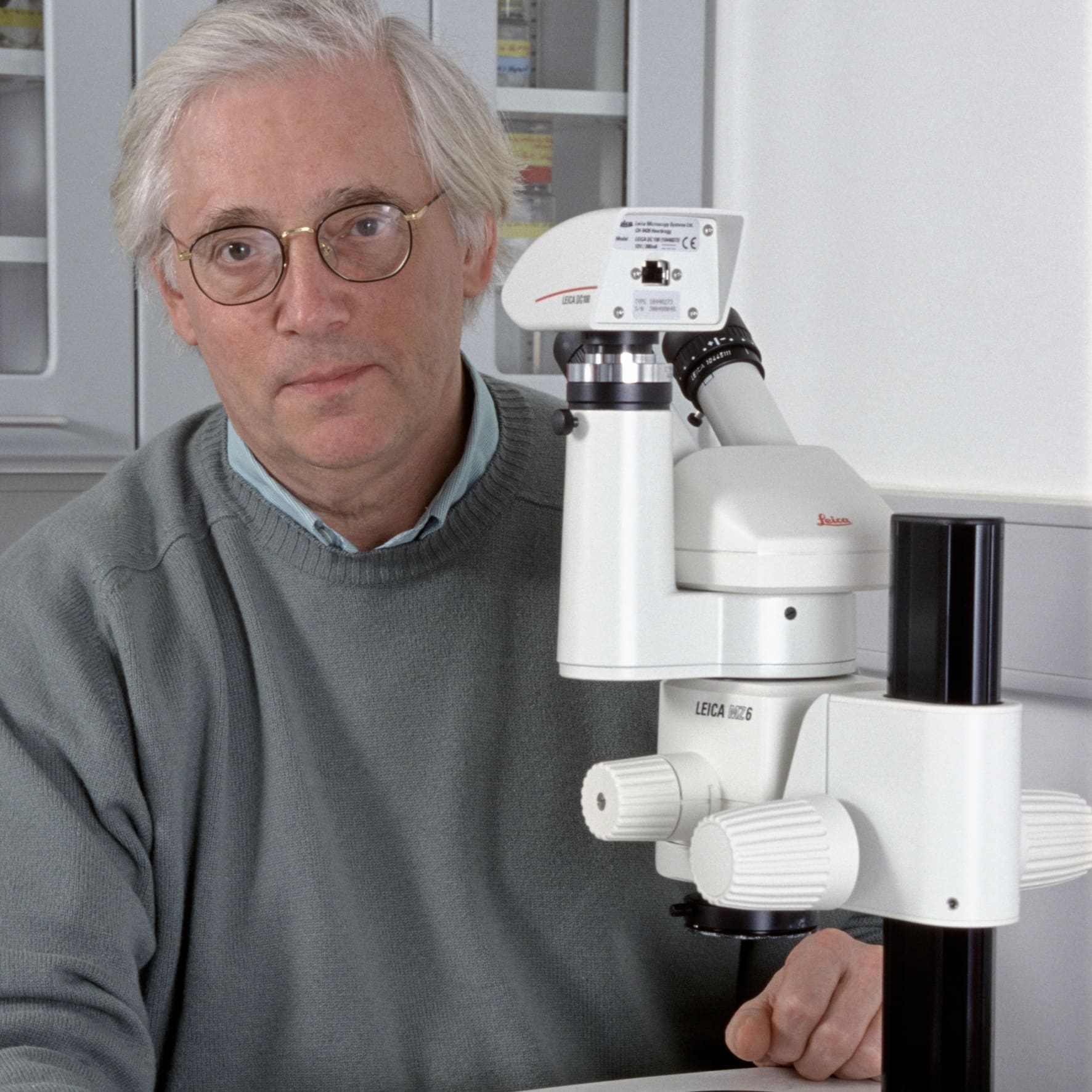 John Walker with a microscope