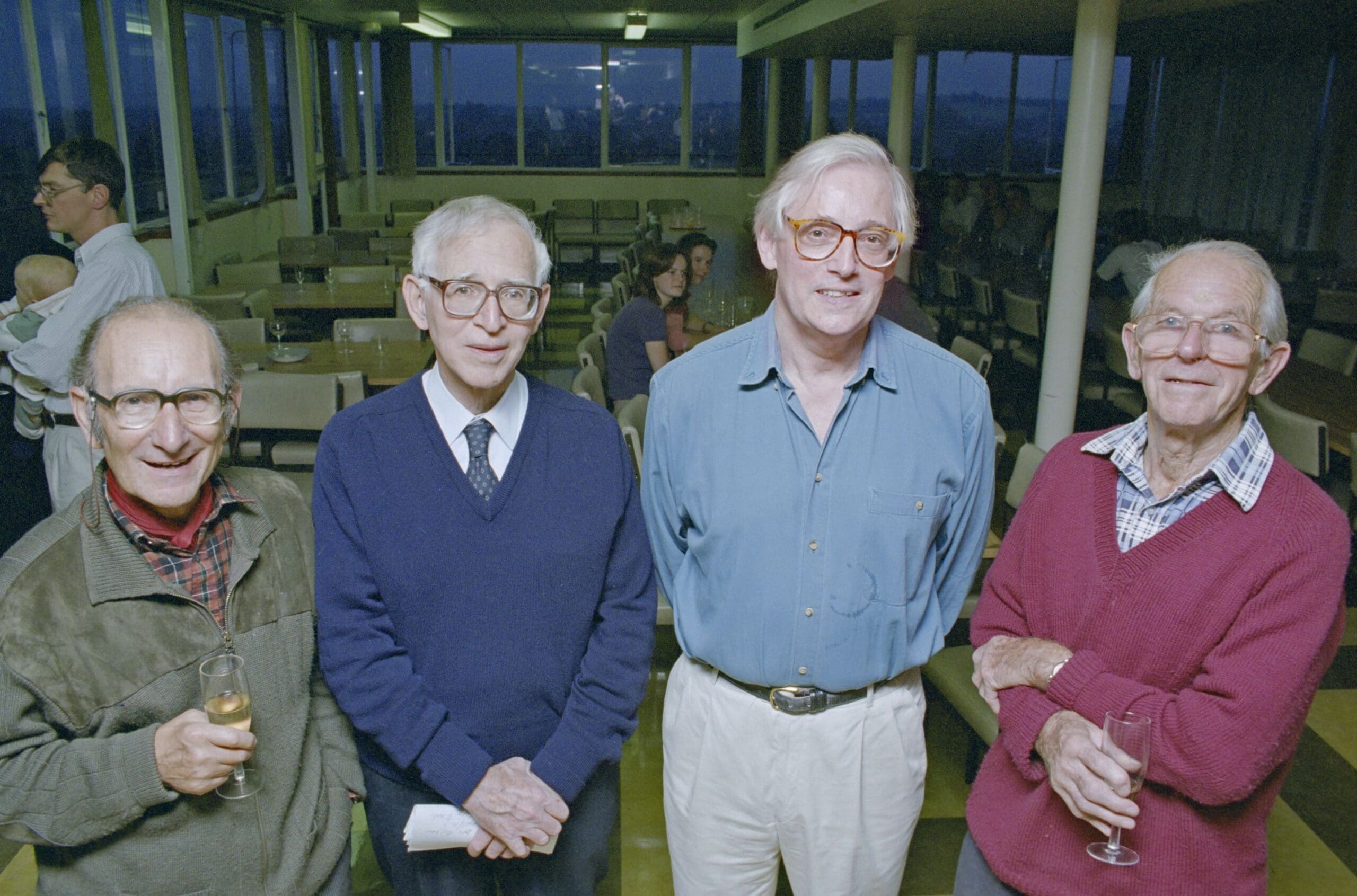 César Milstein, Aaron Klug, John Walker and Fred Sanger stood in the LMB canteen