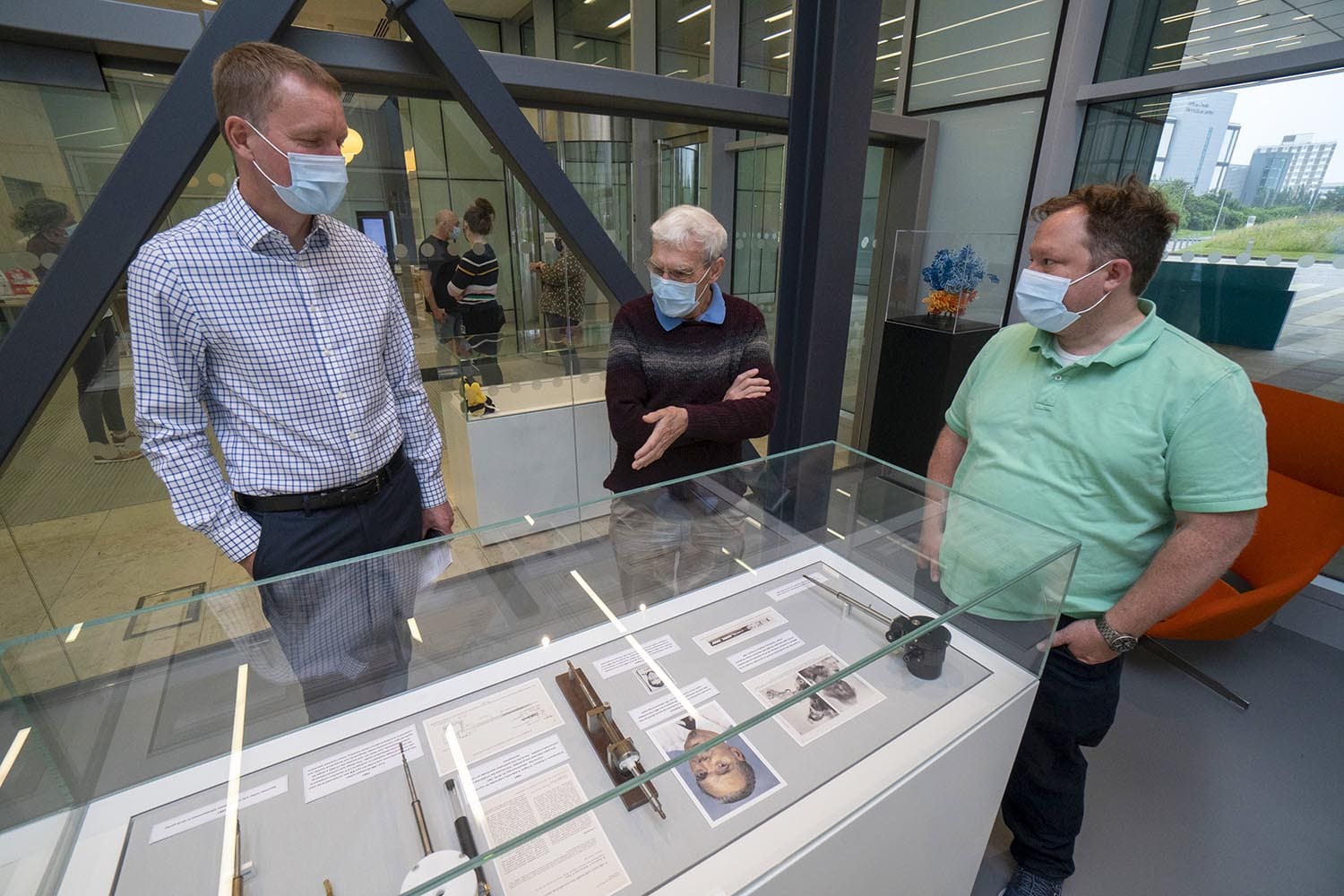 LMB Director Jan Löwe and Group Leaders Richard Henderson and Chris Russo visit the inaugural exhibition in the LMB’s new exhibition room.