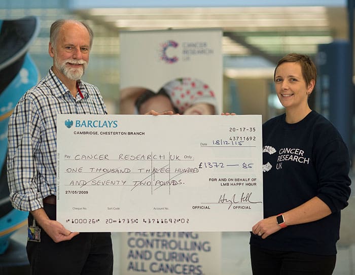 LMB give cheque to Cancer research UK