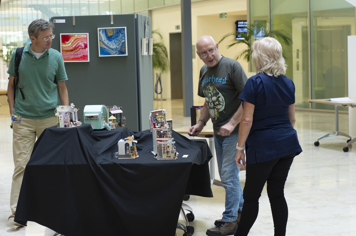 Three LMB staff at the exhibition