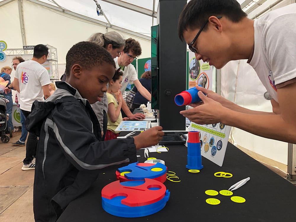 Visitors learning about cryo-EM in Ely