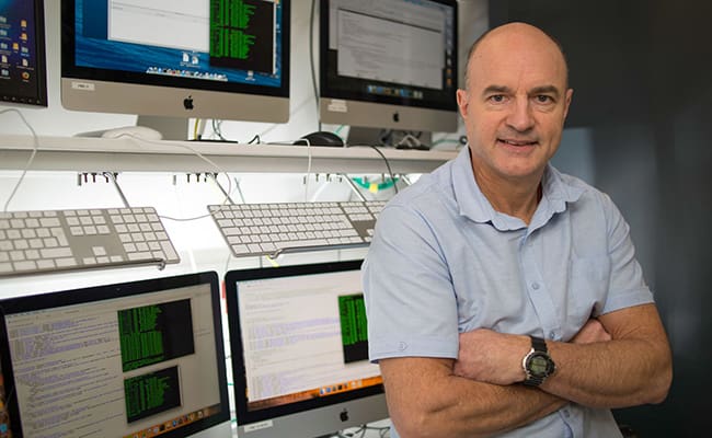 Man with arms folded stood in front of