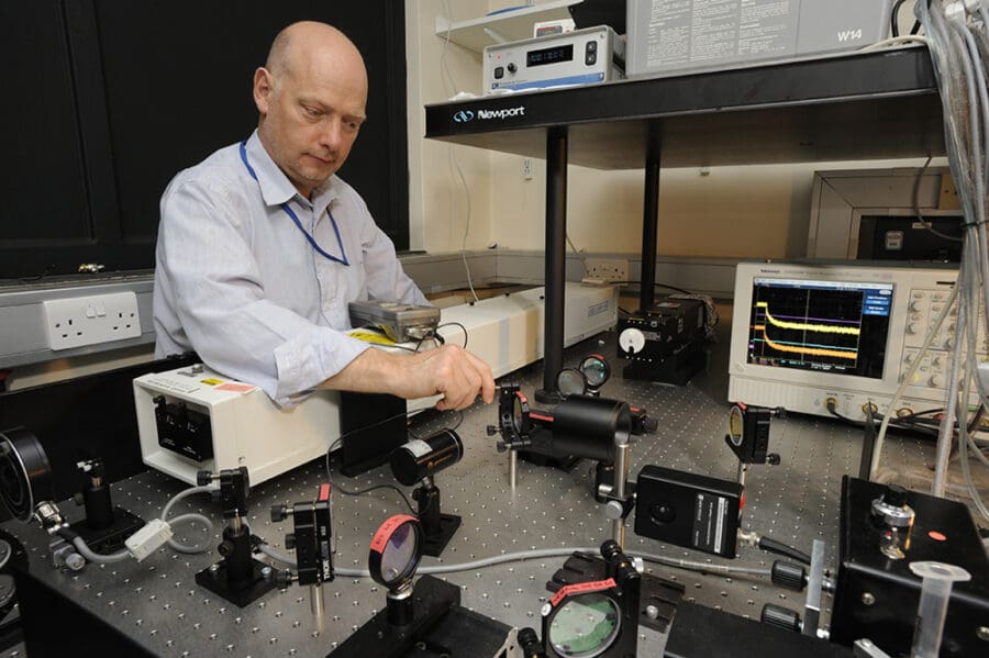 Chris Johnson working with biophysics instruments at the LMB, 2010
